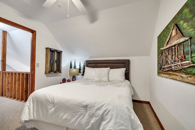 bedroom featuring a textured ceiling, ceiling fan, carpet, and vaulted ceiling