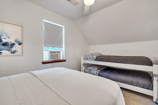 carpeted bedroom with vaulted ceiling, ceiling fan, and cooling unit