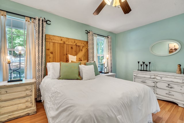 bedroom featuring ceiling fan and light hardwood / wood-style flooring