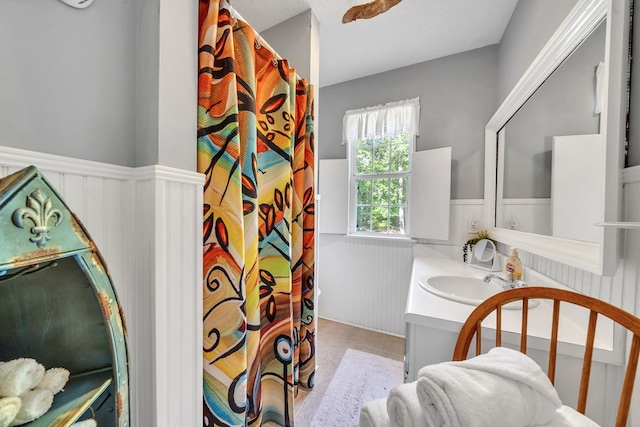 bathroom featuring tile patterned flooring and vanity