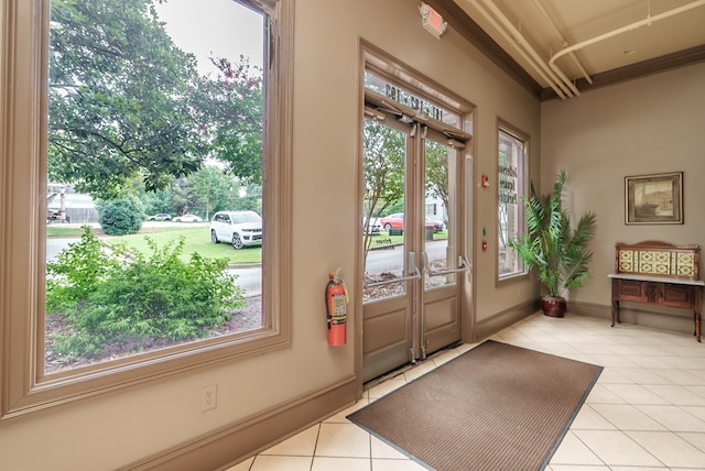 doorway featuring light tile patterned floors and french doors