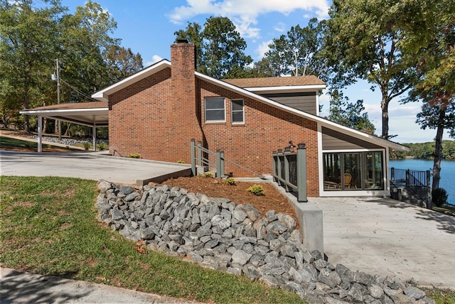 view of home's exterior featuring a carport