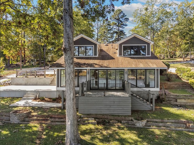 back of house with a sunroom