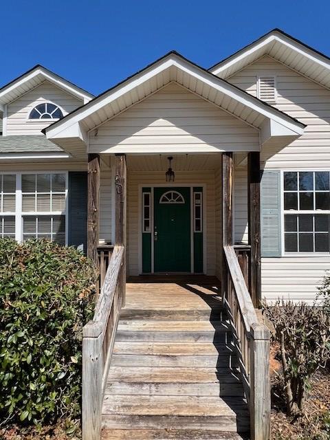 entrance to property with a porch