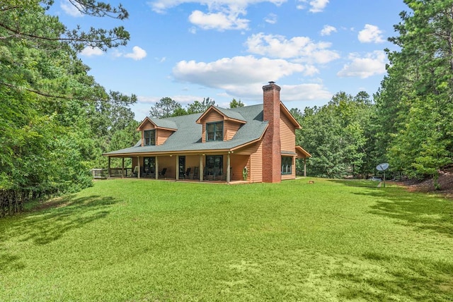 back of house featuring a yard