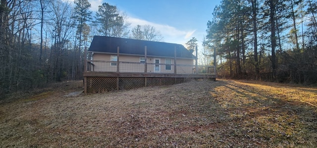 back of house featuring a wooden deck