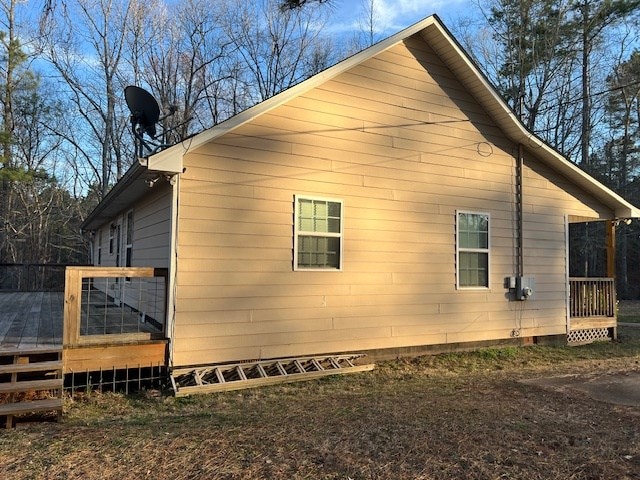 view of side of property featuring a deck