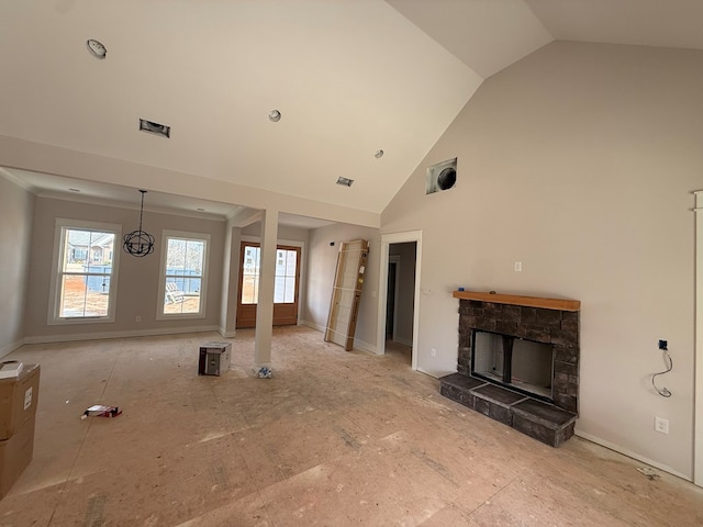 unfurnished living room featuring lofted ceiling and a stone fireplace