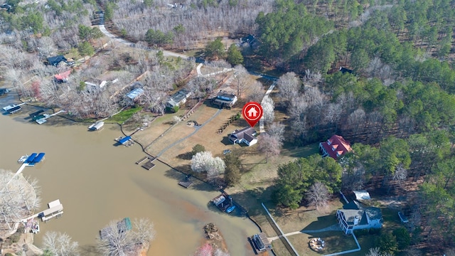 bird's eye view featuring a wooded view