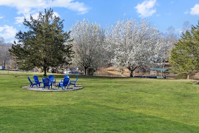 view of yard with an outdoor fire pit