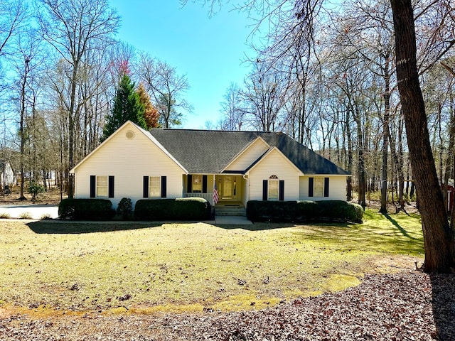 single story home featuring a front lawn