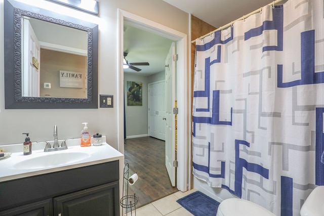 287 Napier Rd, Eatonton, GA 31024 - bathroom featuring toilet, vanity, ceiling fan, tile patterned flooring, and a shower with shower curtain