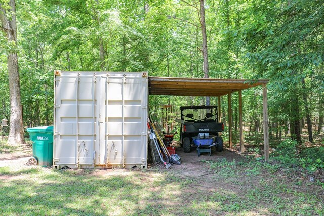 287 Napier Rd, Eatonton, GA 31024 - view of outbuilding with a wooded view