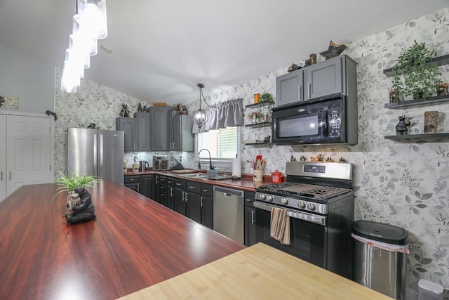 287 Napier Rd, Eatonton, GA 31024 - kitchen featuring wood counters, stainless steel appliances, a sink, open shelves, and lofted ceiling