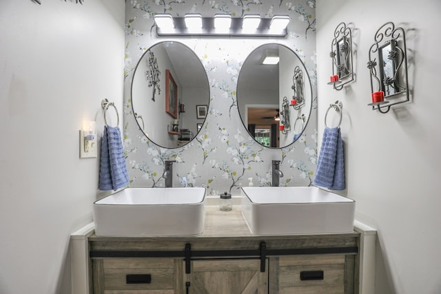 287 Napier Rd, Eatonton, GA 31024 - bathroom featuring wallpapered walls and double vanity