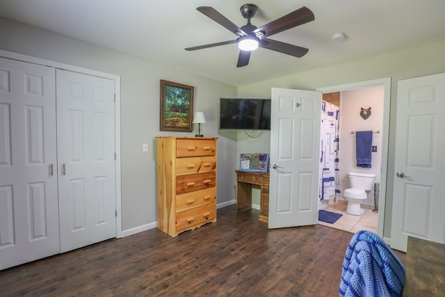 287 Napier Rd, Eatonton, GA 31024 - bedroom with dark wood-type flooring, baseboards, a closet, ensuite bathroom, and a ceiling fan