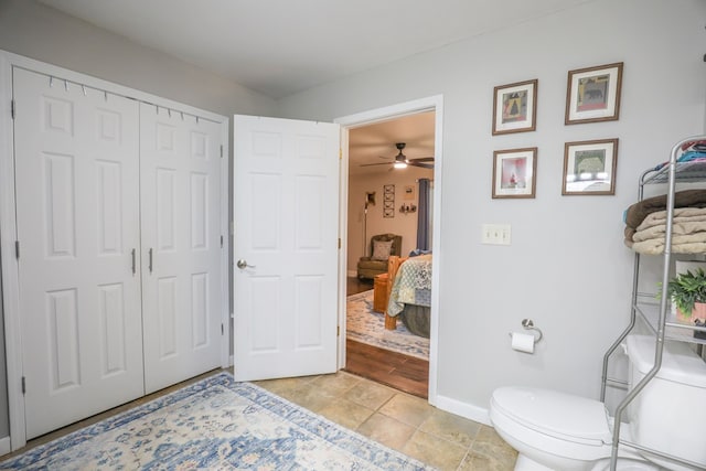 287 Napier Rd, Eatonton, GA 31024 - bathroom with baseboards, toilet, tile patterned flooring, and ceiling fan