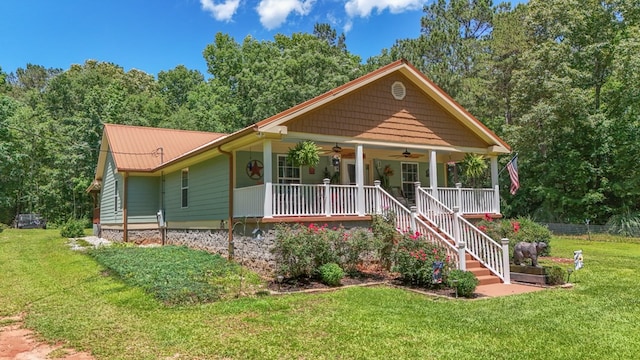 287 Napier Rd, Eatonton, GA 31024 - view of front facade with a ceiling fan, covered porch, metal roof, and stairway