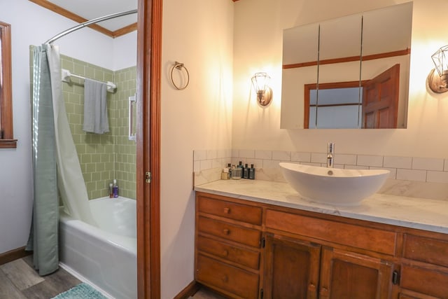 3715 Sinclair Dam Rd, Milledgeville, GA 31061 - full bathroom featuring crown molding, vanity, wood finished floors, baseboards, and shower / bath combination with curtain