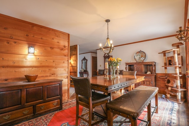3715 Sinclair Dam Rd, Milledgeville, GA 31061 - dining room with ornamental molding, wood finished floors, a notable chandelier, and wood walls