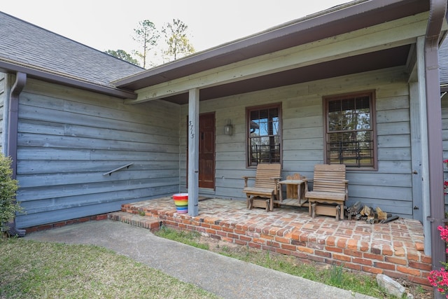 3715 Sinclair Dam Rd, Milledgeville, GA 31061 - doorway to property featuring a porch and roof with shingles