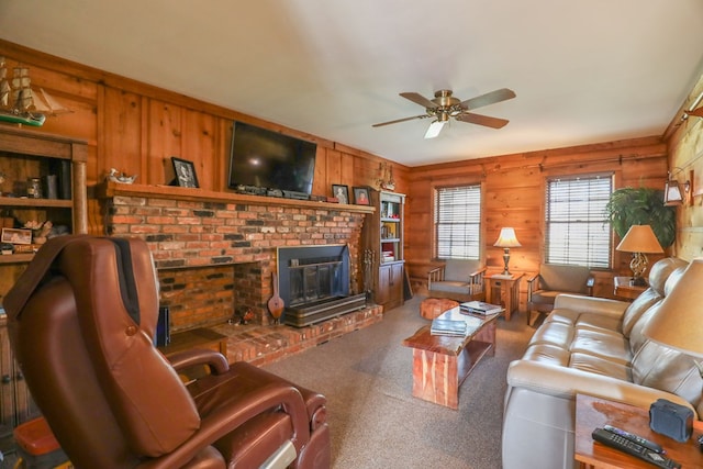 3715 Sinclair Dam Rd, Milledgeville, GA 31061 - carpeted living area with wooden walls, a fireplace, and ceiling fan