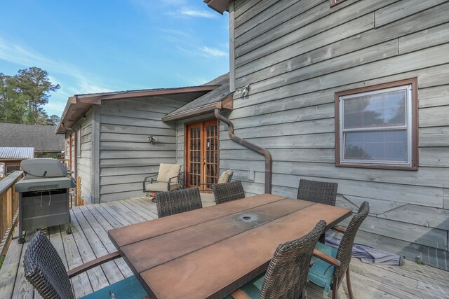 3715 Sinclair Dam Rd, Milledgeville, GA 31061 - wooden deck featuring a grill and outdoor dining space
