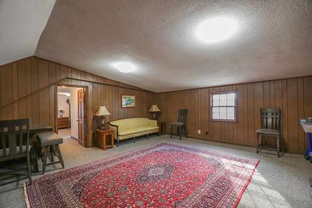 3715 Sinclair Dam Rd, Milledgeville, GA 31061 - interior space featuring light colored carpet, wooden walls, vaulted ceiling, and a textured ceiling