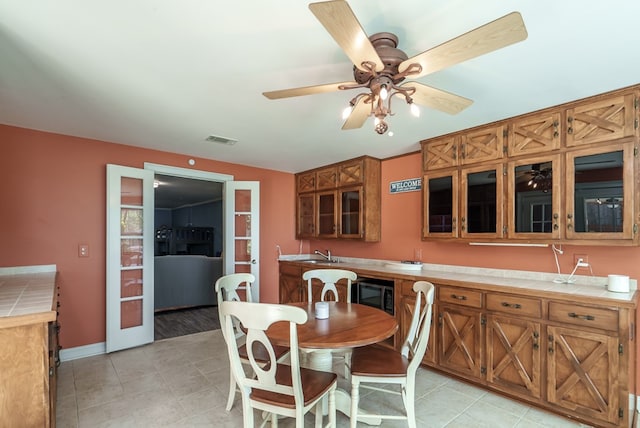 116 Island Dr, Milledgeville, GA 31061 - dining area with ceiling fan, light tile patterned floors, and baseboards