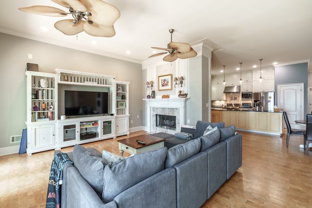 116 Island Dr, Milledgeville, GA 31061 - living area featuring a ceiling fan, recessed lighting, baseboards, ornamental molding, and a fireplace