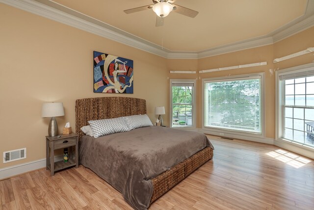 116 Island Dr, Milledgeville, GA 31061 - bedroom featuring multiple windows, crown molding, light wood-type flooring, baseboards, and ceiling fan