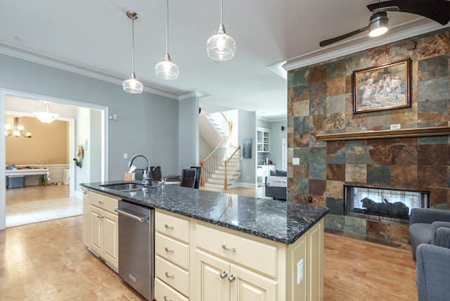116 Island Dr, Milledgeville, GA 31061 - kitchen with open floor plan, crown molding, a sink, cream cabinets, and stainless steel dishwasher