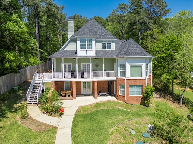 116 Island Dr, Milledgeville, GA 31061 - rear view of house with french doors, a chimney, roof with shingles, brick siding, and a patio