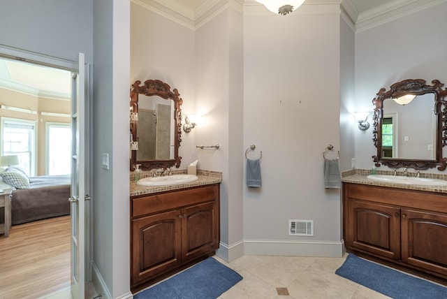 116 Island Dr, Milledgeville, GA 31061 - full bath featuring crown molding, healthy amount of natural light, two vanities, baseboards, and tile patterned floors