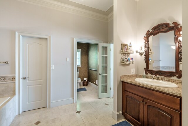 116 Island Dr, Milledgeville, GA 31061 - bathroom featuring ornamental molding, tile patterned flooring, toilet, vanity, and french doors