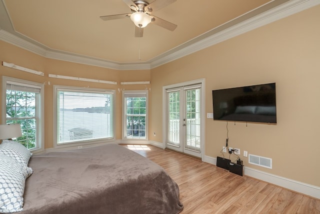 116 Island Dr, Milledgeville, GA 31061 - bedroom featuring access to exterior, wood finished floors, ornamental molding, multiple windows, and baseboards