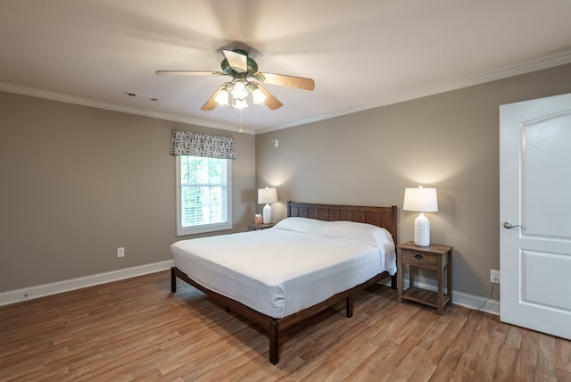 116 Island Dr, Milledgeville, GA 31061 - bedroom with baseboards, crown molding, light wood-style flooring, and ceiling fan