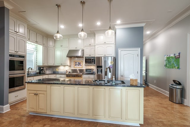 116 Island Dr, Milledgeville, GA 31061 - kitchen featuring appliances with stainless steel finishes, baseboards, a sink, ornamental molding, and under cabinet range hood