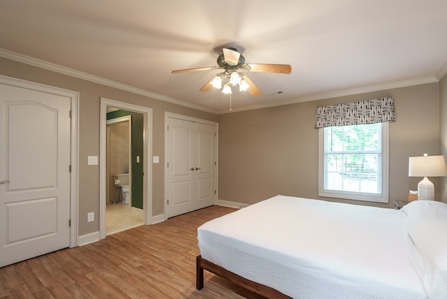 116 Island Dr, Milledgeville, GA 31061 - bedroom with light wood-style floors, crown molding, ensuite bath, baseboards, and ceiling fan
