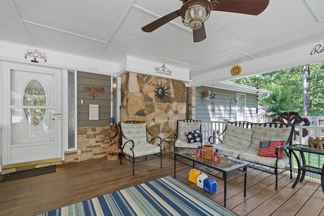 wooden terrace with ceiling fan and covered porch