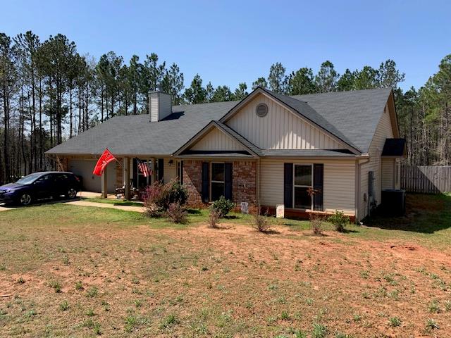 1683 Sara Hunter Ln, Milledgeville, GA 31061 - view of front of house with a chimney and a garage