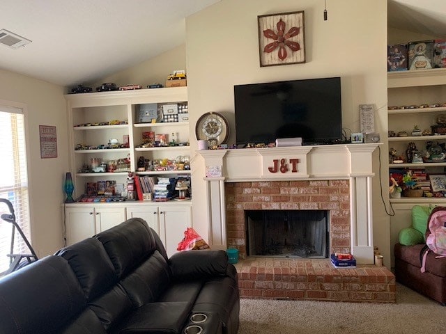 1683 Sara Hunter Ln, Milledgeville, GA 31061 - living room with lofted ceiling, a brick fireplace, and carpet floors