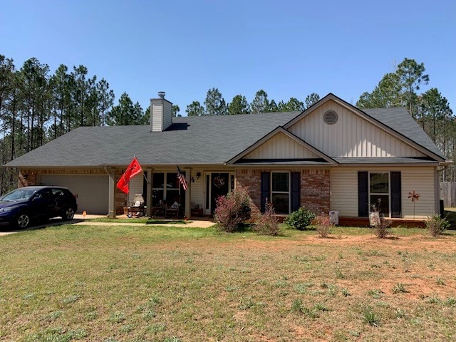 1683 Sara Hunter Ln, Milledgeville, GA 31061 - single story home featuring an attached garage, a front yard, and a chimney