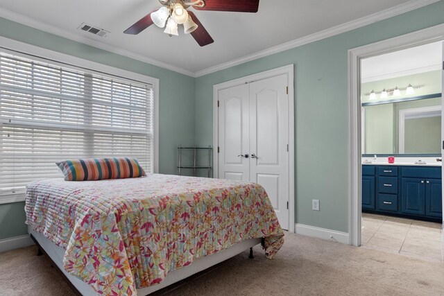 full bathroom with vanity, tile patterned floors, crown molding, shower / washtub combination, and toilet