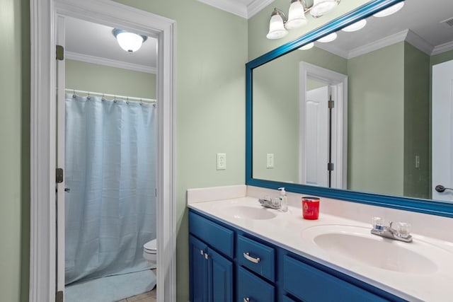 full bathroom featuring crown molding, shower / tub combo with curtain, vanity, and toilet