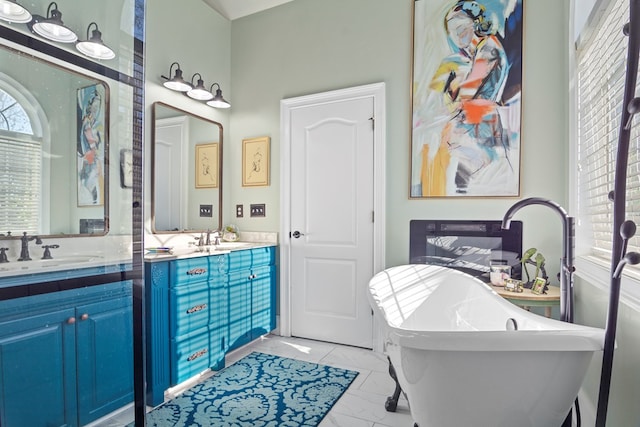 bathroom with vanity and a tub