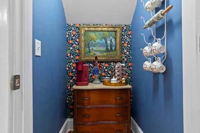 bathroom featuring lofted ceiling