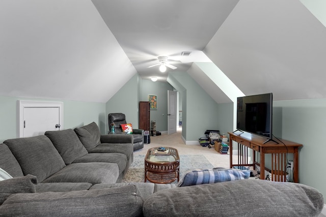 living room with ceiling fan, light colored carpet, and lofted ceiling with skylight