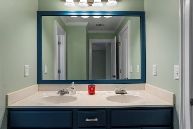 bathroom featuring crown molding and vanity