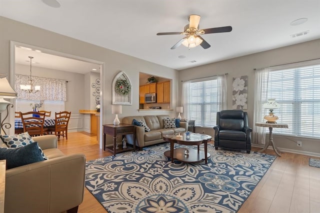 living room with a wealth of natural light and light wood-type flooring